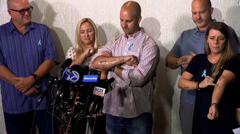 Gabby Petitos parents and stepparents showing their matching tattoos in her memory at a news conference on Tuesday, September 28.